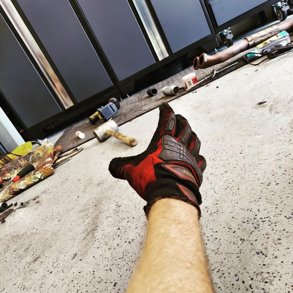 Hand reaching out for a hammer